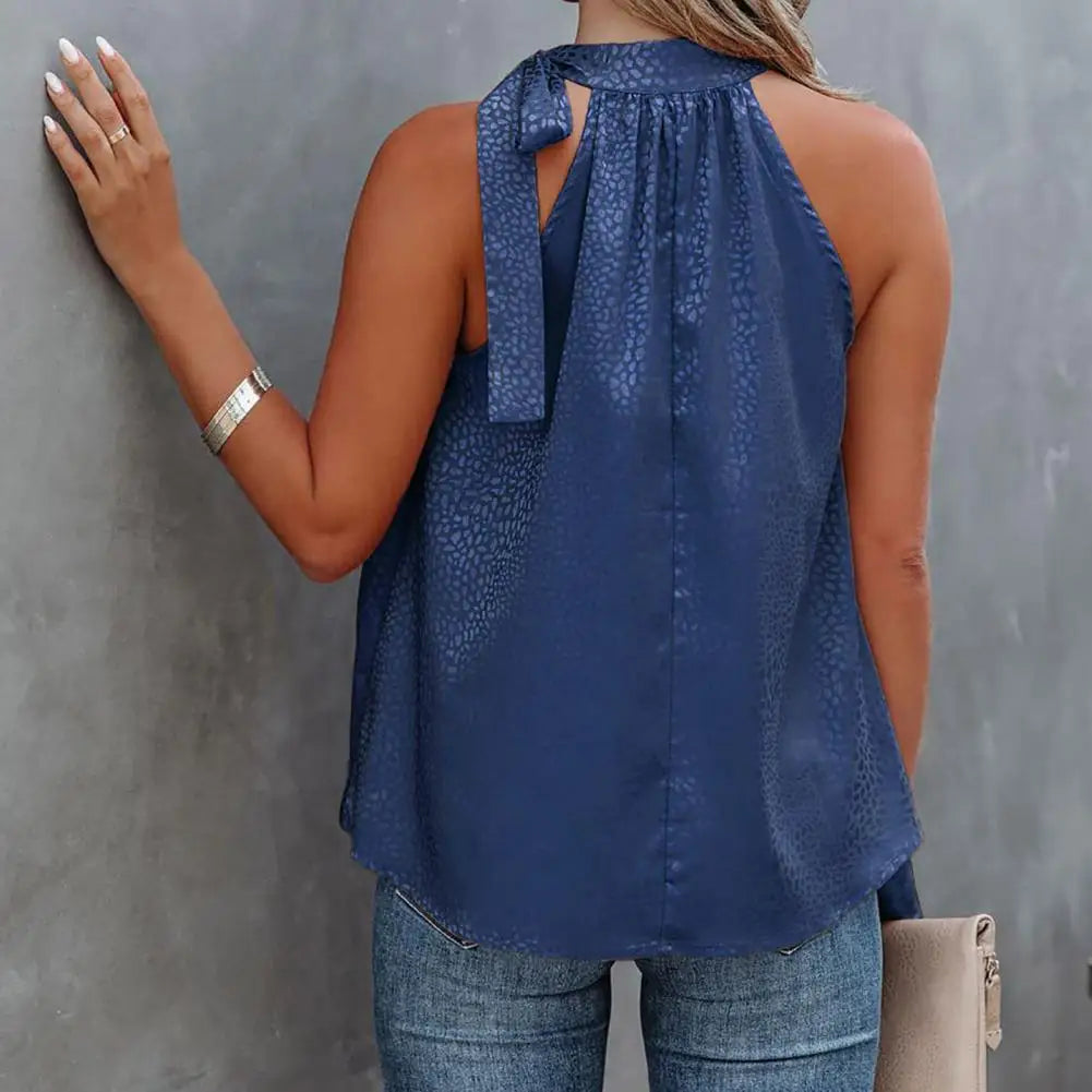 https://cdn.shopify.com/s/files/1/0822/8919/7383/files/Summer-Elegant-Women-Blouse-Leopard-Side-Bow-Summer-Temperament-Sleeveless-Loose-fitting-Ladies-Top-for-Office_299e9f09-830b-4300-82fe-e5f8a0df3857.webp?v=1737537083
