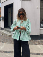 https://cdn.shopify.com/s/files/1/0822/8919/7383/files/Women-Fashion-Print-Lace-Up-Puff-Sleeve-T-Shirt-Elegant-Casual-Loose-Round-Neck-Tops-2024_61fba4a3-3617-4715-8c55-f76515e9de28.webp?v=1722343244
