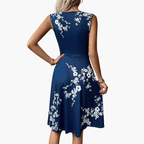https://cdn.shopify.com/s/files/1/0980/8547/0533/files/Women_sSleevelessV-NeckFloralMidiDress_1.png?v=1777384495
