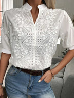 https://cdn.shopify.com/s/files/1/0822/8919/7383/files/Zomer-Bloemen-Borduren-Lace-Blouse-Vrouwen-Hollow-Out-Stand-Kraag-V-hals-Casual-Shirt-Elegante-Korte_6645acf5-c797-4a3b-a76f-344555d0b968.webp?v=1737537078