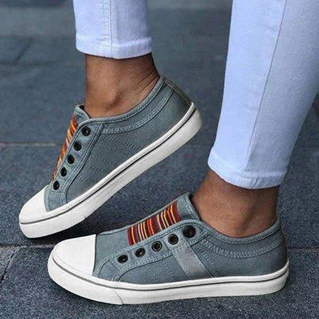 https://cdn.shopify.com/s/files/1/0868/7468/5776/files/thea-womens-slip-on-striped-sneakers-1.jpg?v=1779233713
