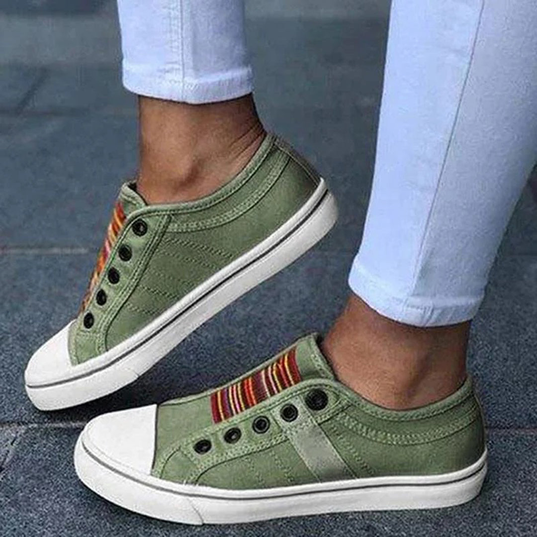 https://cdn.shopify.com/s/files/1/0868/7468/5776/files/thea-womens-slip-on-striped-sneakers-3.jpg?v=1779233718